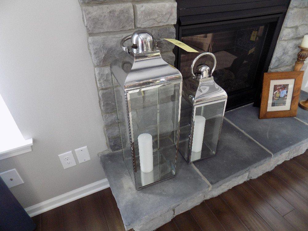 Pair of metal lantern-style candle holders