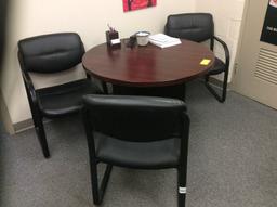 Round table and three chairs