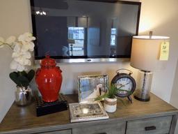 Glass lamp, red jar, and clock