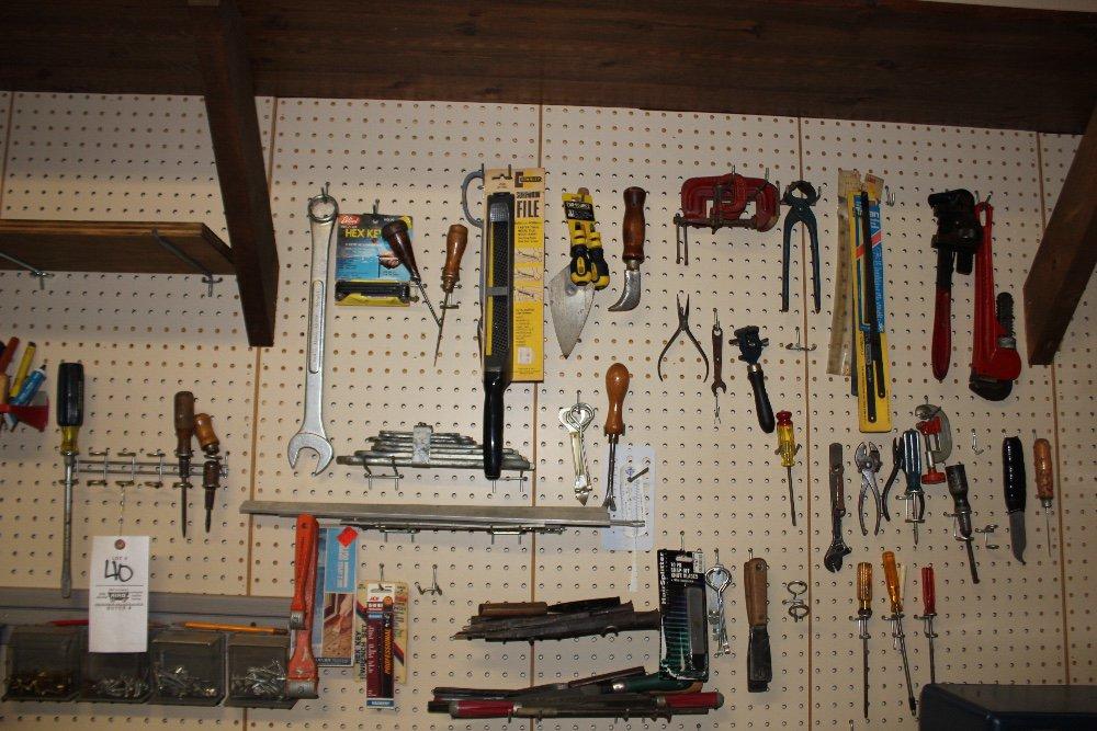 Contents of peg board incl.: hand tools & bolt stock