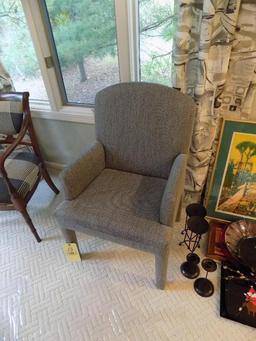 Grey upholstered arm chair