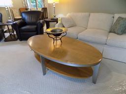 Metal-framed oval coffee table