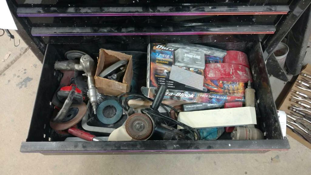 Contents of tool cabinet base including screwdrivers, flange puller, body tools, and Sanders.