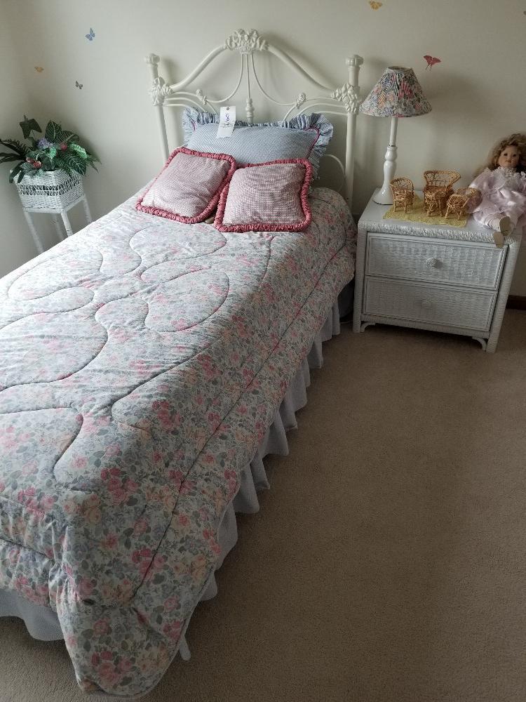 White twin bed with matress, wicker dresser and nightstand