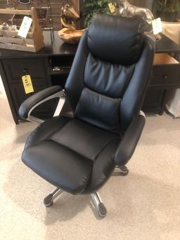 Dark wood office desk. With swivel office chair.