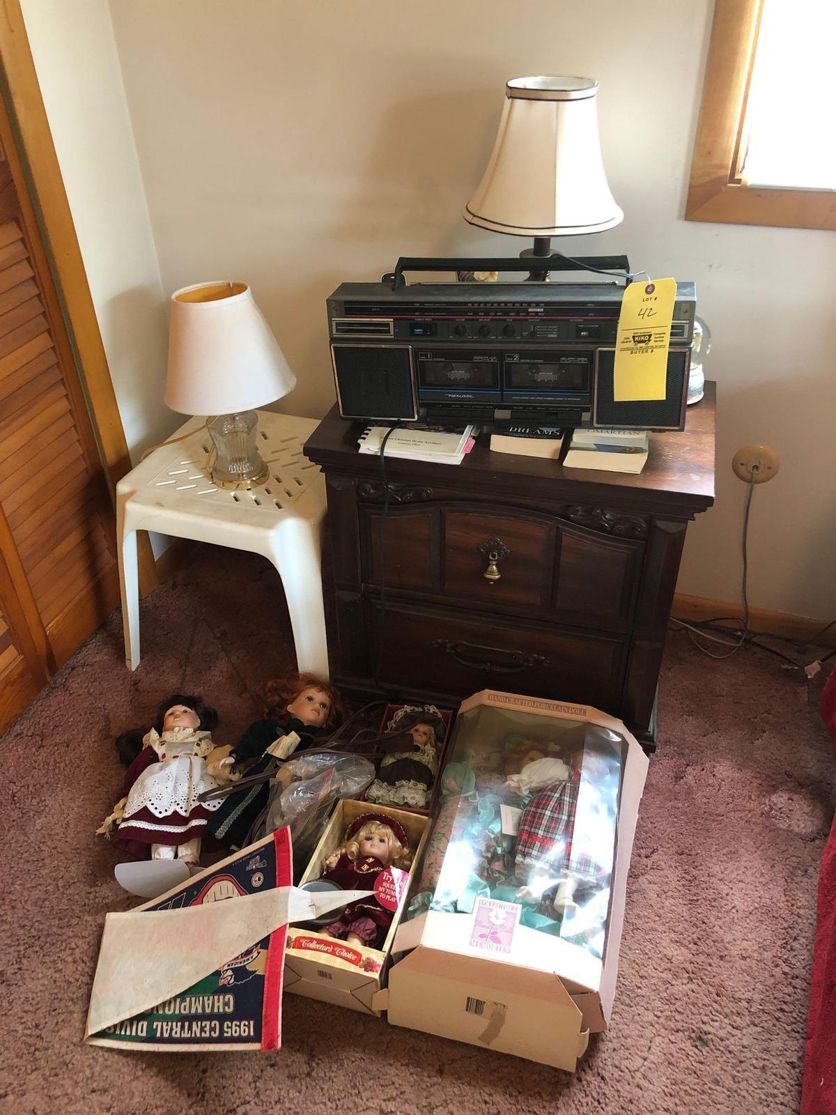 Nightstand, radio and dolls