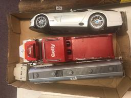 Diecast replica airplane, metal coin bank, headliner bobble heads, diecast vehicles