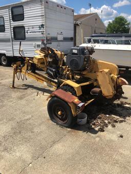 Rayco RG 1625 stump grinder on trailer