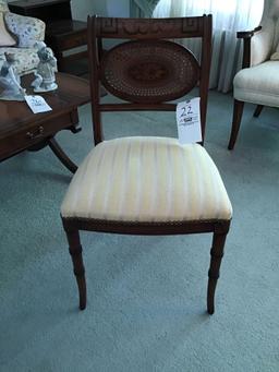 Stenciled and cane-back chair with nail head trim