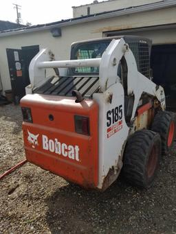 Bobcat S185 skid steer, diesel, and material bucket, 2,216 hours, spare tire