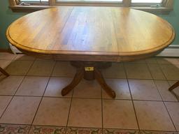 Oak pedestal dining table w/ one leaf, 5' long w/ leaf x 42" wide.