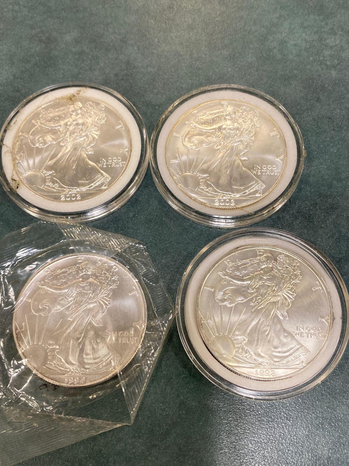 (4) Silver American Eagle coins, each one ounce of .999 fine silver. Bid times four. (1994, 1998, &