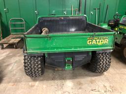 John Deere electric turf gator w/ charger, 2,058 hrs., 43 x 48 electric dump bed