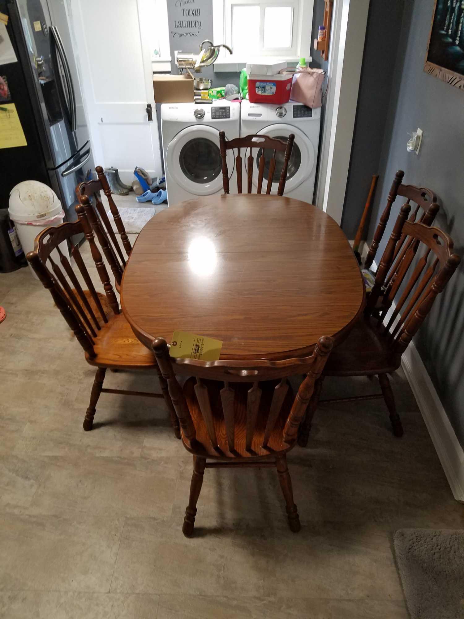 Tell city oak table with formica top, 2 extra leaves and 6 oak chairs