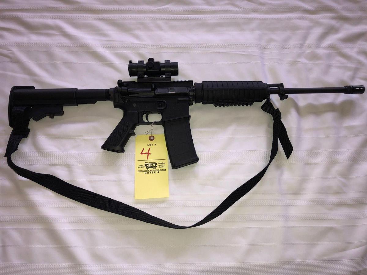 Bushmaster Carbon - 15 - 5.56/223 cal. AR Rifle w/red dot scope