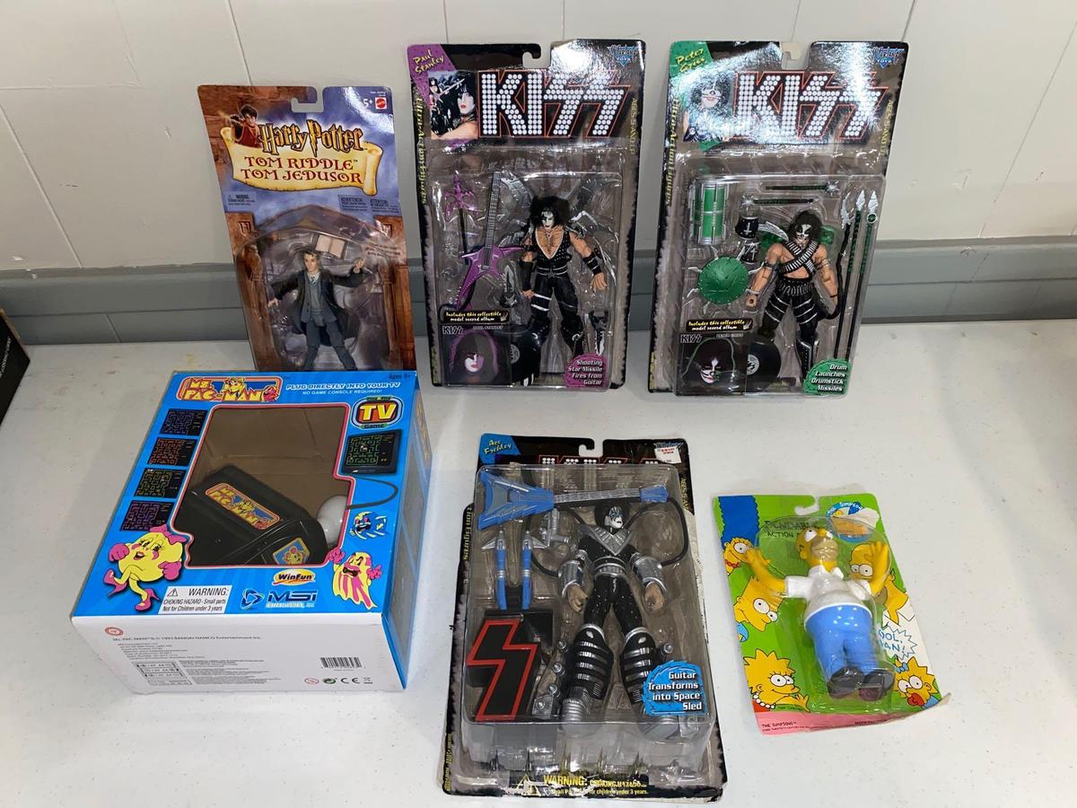 Kiss action figures, Harry Potter, Homer Simpson, Miss Pac-man game