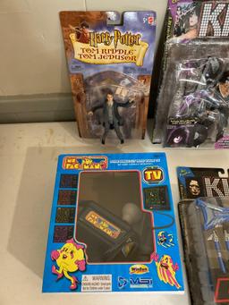 Kiss action figures, Harry Potter, Homer Simpson, Miss Pac-man game