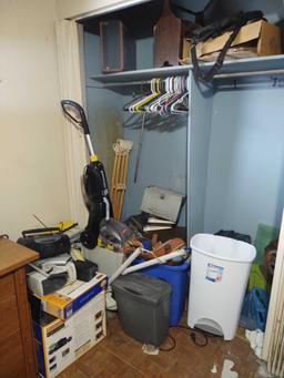 Contents of closet including paper shredder, Bissell Power vac, radio, keyboards and suitcases