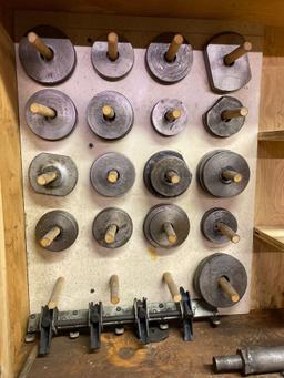 Assorted sleeve puller plates with cabinet