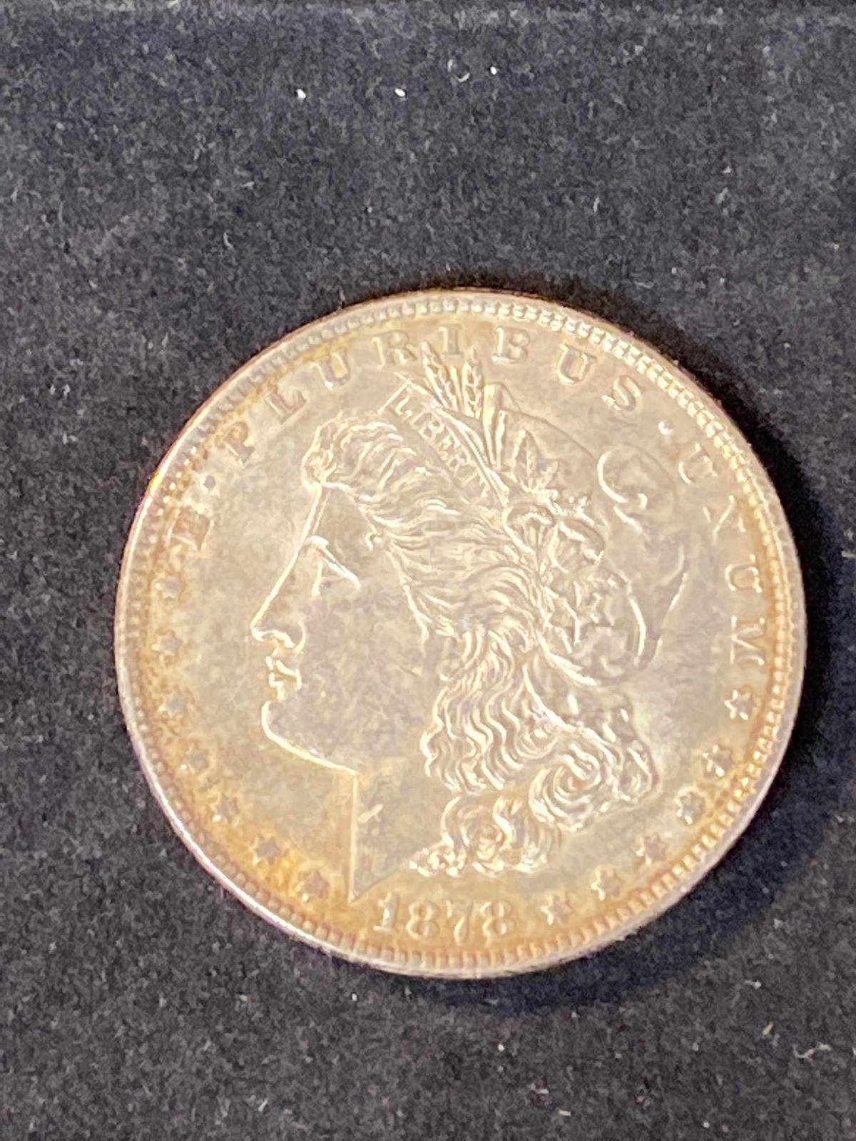 1878 Morgan dollar, (7) tail feathers, AU.