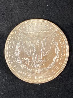 1879 Morgan dollar, AU.