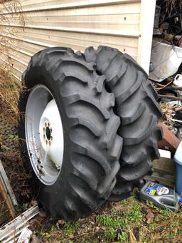 13.6-28 tires mounted on rims with 8 bolt centers