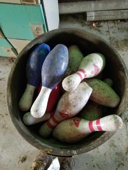 Trash can full of bowling pins