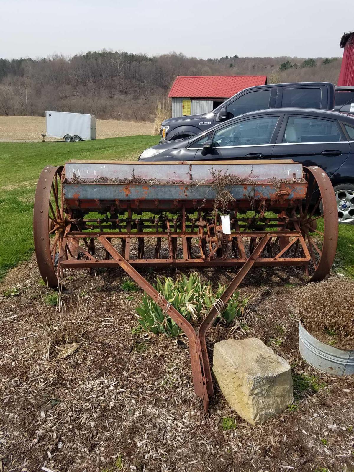 Case steel wheel pull behind planter, approx 108 inches wide