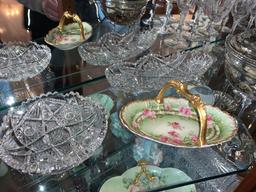 Contents of 3 shelves, stemware, silver plate, art glass, cut glass