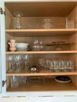 Contents of dining room server, glasses, stemware, Tupperware, baking dishes, and more