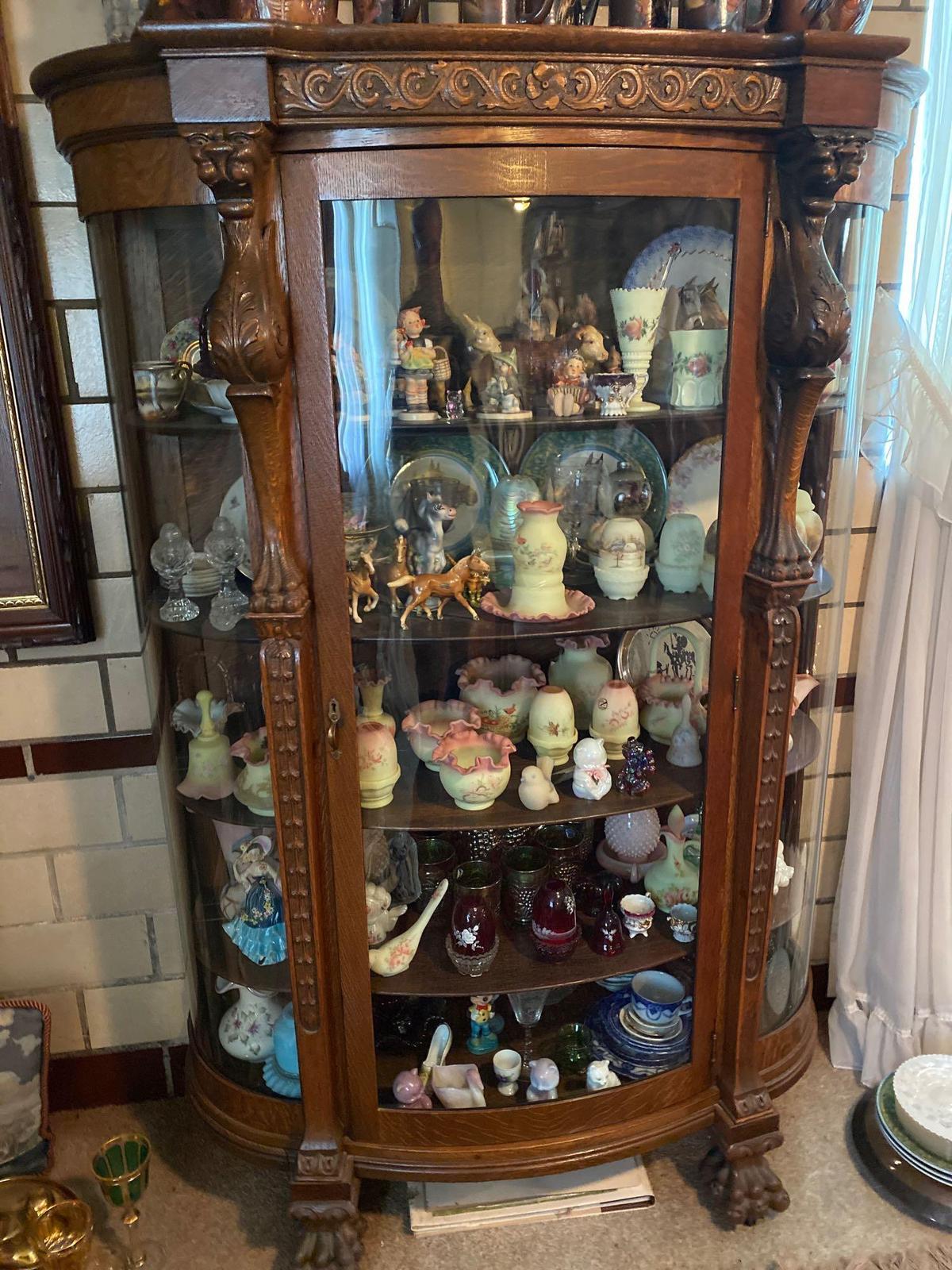 Old oak china cupboard w/ carved griffins & claw feet, 67" tall x 46" wide.