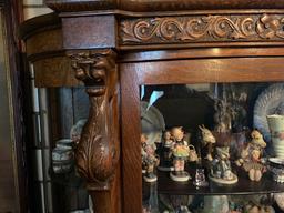 Old oak china cupboard w/ carved griffins & claw feet, 67" tall x 46" wide.