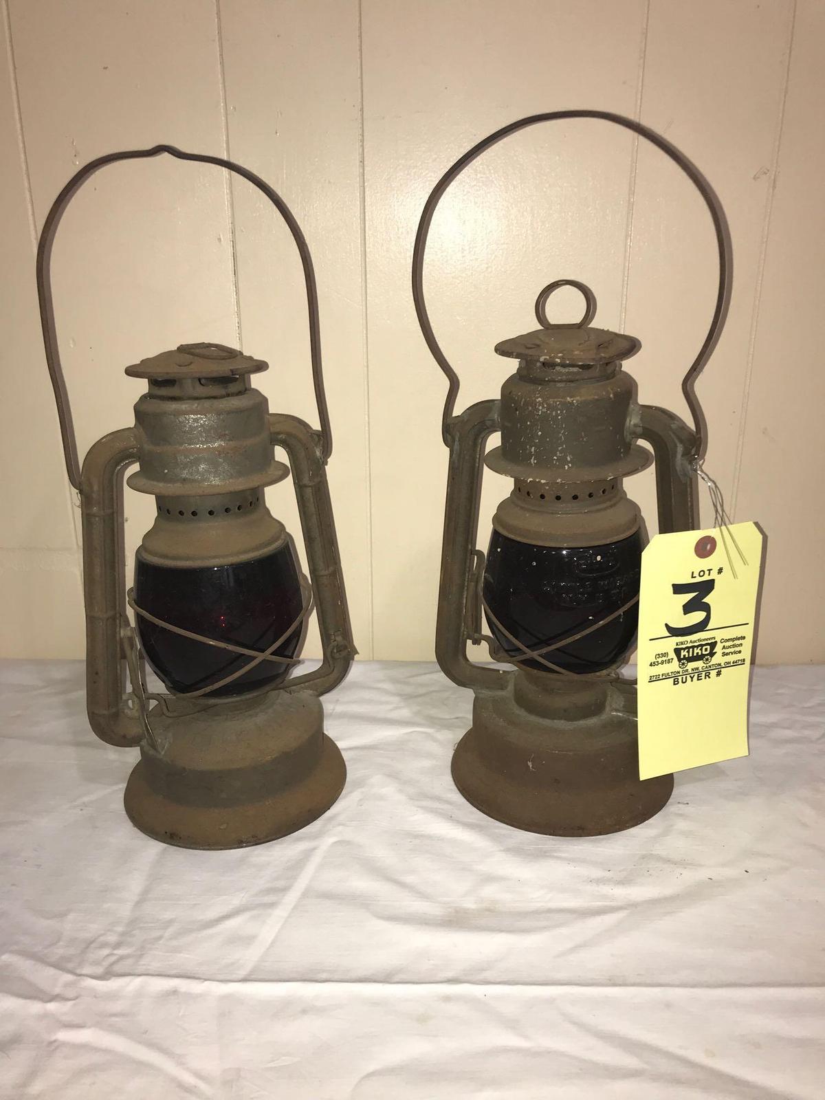 Two Barn Lanterns with red shades