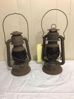 Two Barn Lanterns with red shades