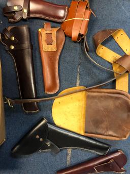 Box of leather holsters, belt, purses, etc