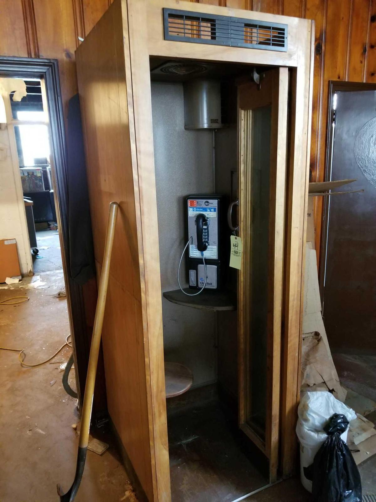 Wooden phone booth with phone