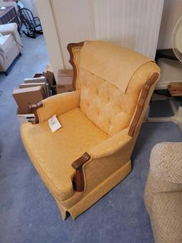 Yellow upholstered wood framed swivel chair