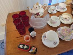 Cups and saucers, red tumblers, covered hen, sadler teapot