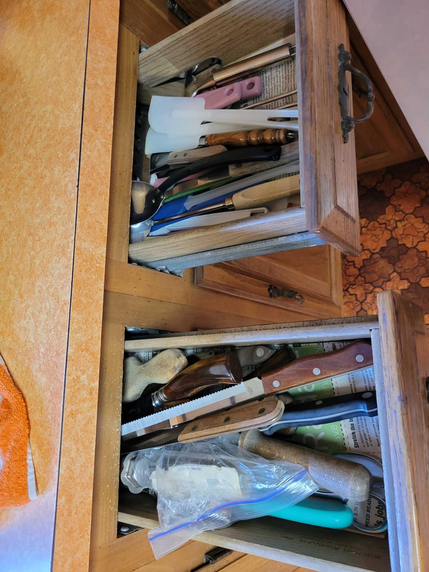 Contents of kitchen cupboards below countertop