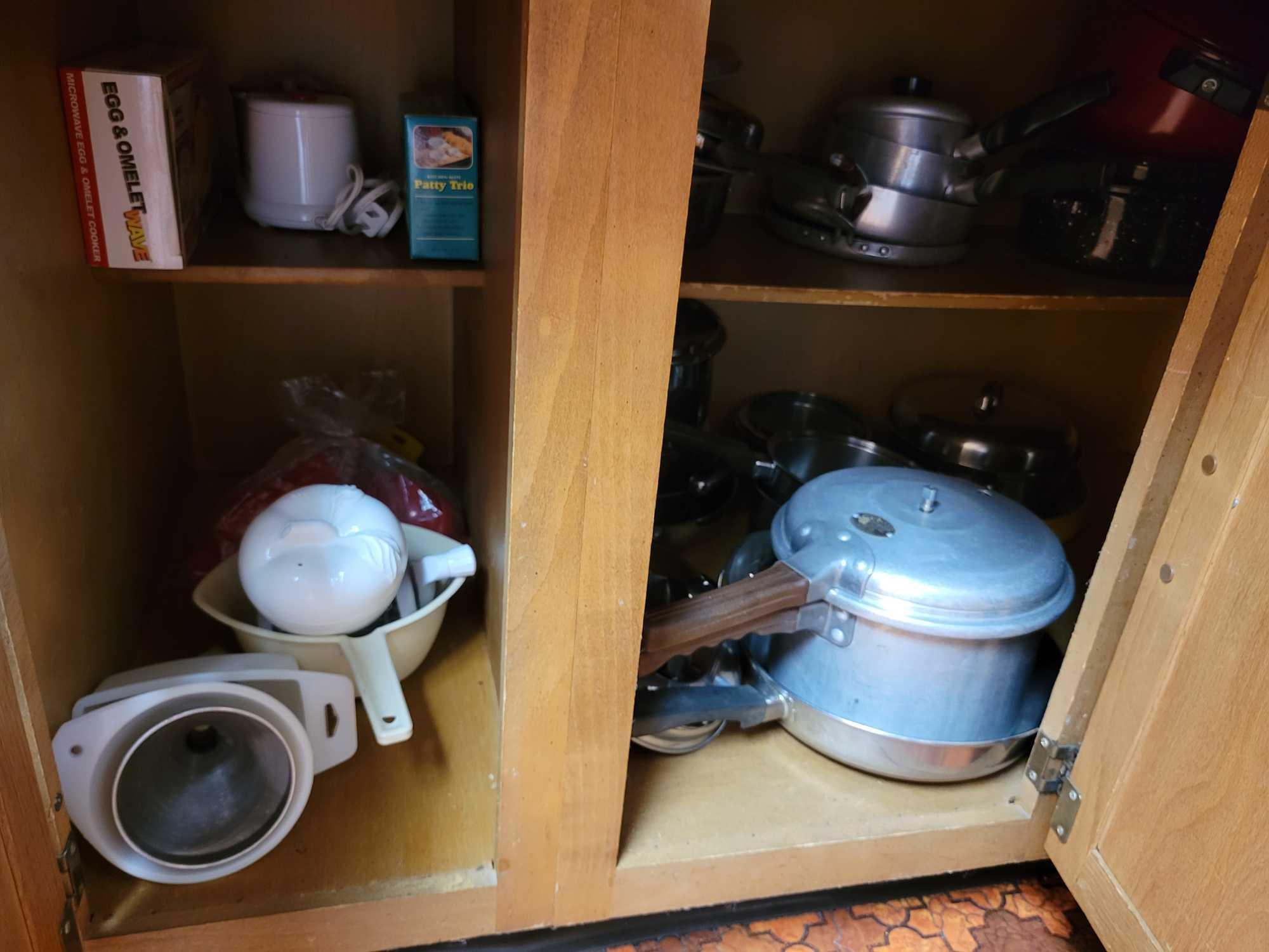 Contents of kitchen cupboards below countertop