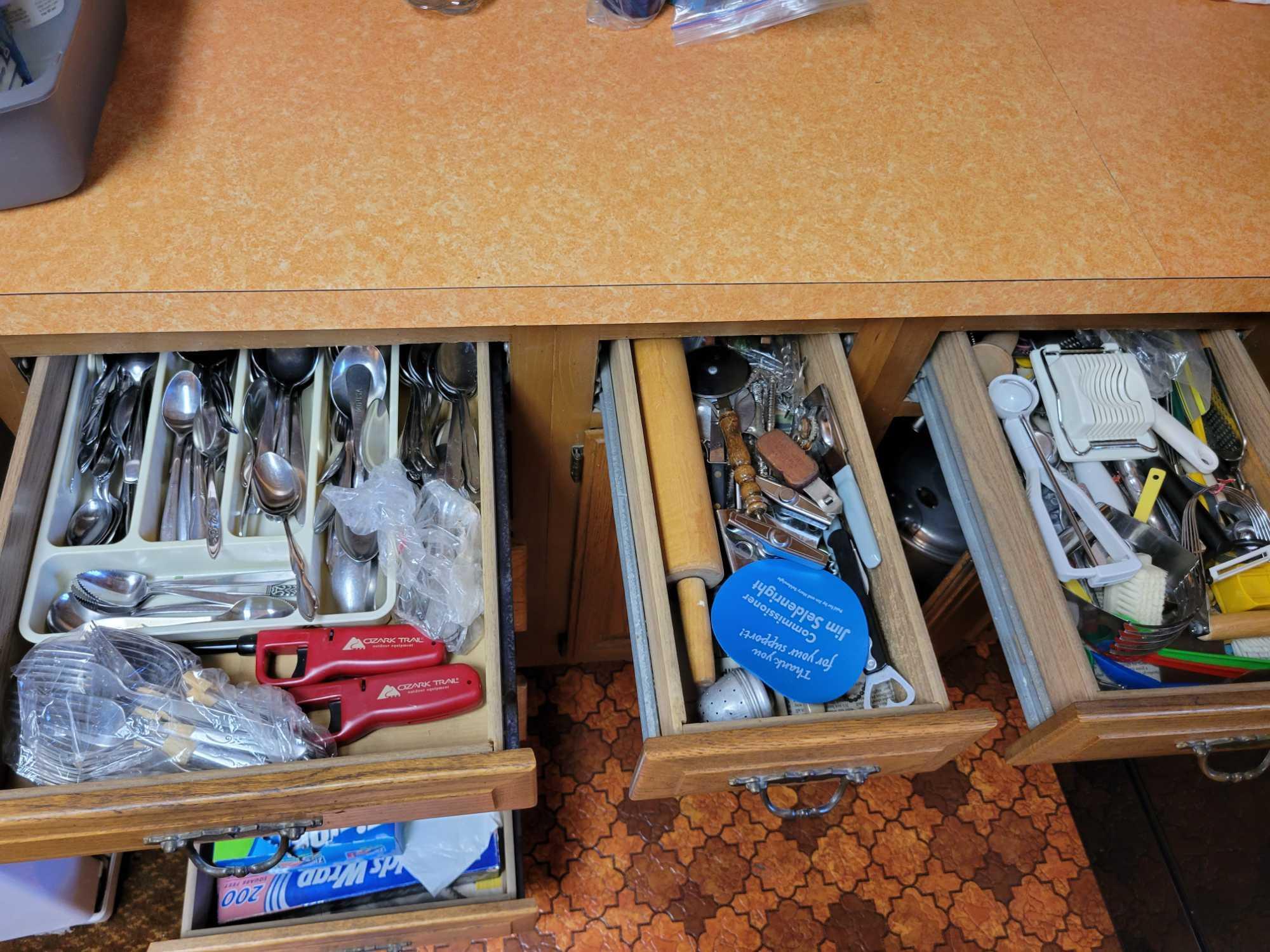 Contents of kitchen cupboards below countertop