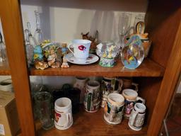 Lot steins, glass bells, figurines, and vases