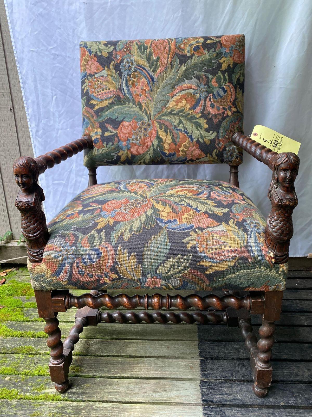 Antique Tudor style arm chair w/ mermaid carved girl & boy on arms, 38" tall.