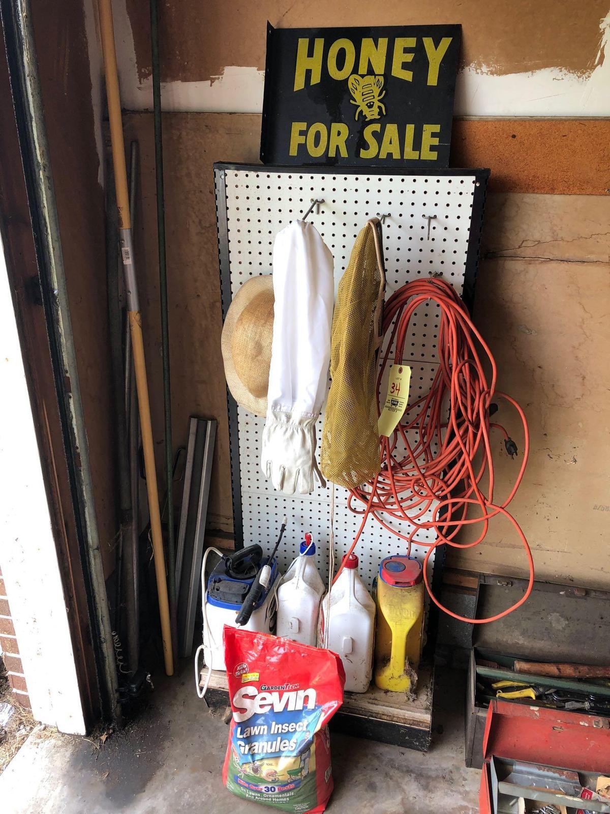 Bee keeper's hat, gloves, sign, weed killer, apple picker