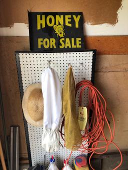 Bee keeper's hat, gloves, sign, weed killer, apple picker