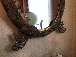 Ornate oval mirror