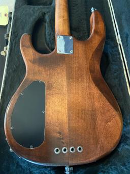 Wooden guitar w/ Carvin hard travel case.