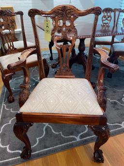 Claw footed Chippendale style dining table w/ (8) chairs, two extra leaves.