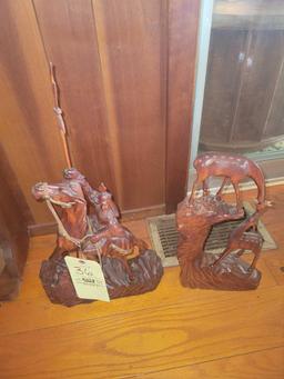 Wood carved deer and rider