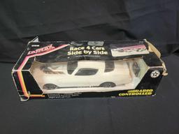 Latrax race 4 cars side-by-side RC car in box with remote